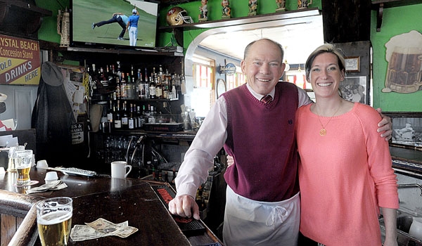 It's a family affair at Hoak's restaurant in Hamburg, with bar tender Patrick Hoak and waitress Aileen Hoak serving the customers. 
(Patrick McPartland/Staff Photographer)