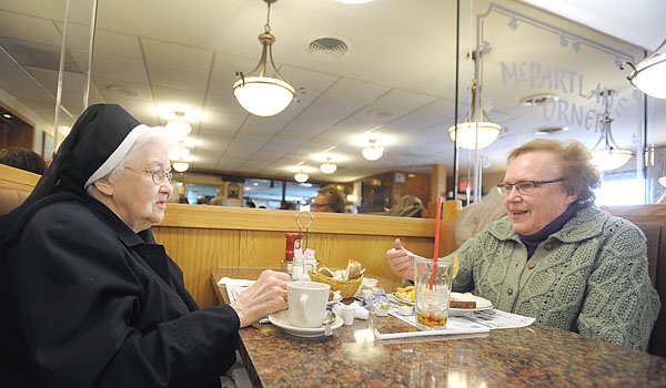 Sister Thomas Aquinas Lennon, SSJ, and Sister Pat Durkin, SSJ, enjoy a Lenten Fish Fry at McPartlan's Corner in Cheektowaga. McPartlan's is famous in the area for their fish fry.
(Patrick McPartland/Staff Photographer)