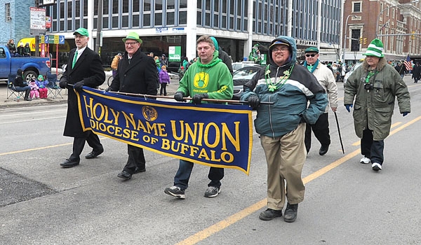 With banner in hand the Diocesan Holy Name Union marches in the annual St. Patrick's Day Parade up Delaware Avenue in the City of Buffalo.
(Patrick McPartland/Staff Photographer)
