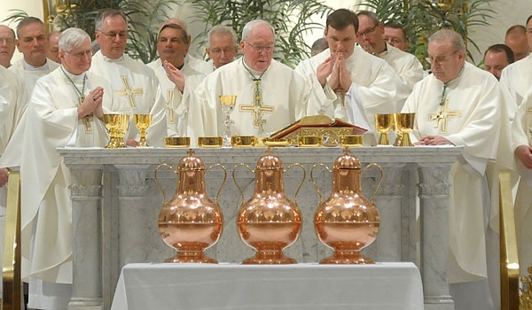 Bishop Richard J. Malone celebrates Mass behind the three holy oils during the the Chrism Mass at St. Joseph Cathedral
(Patrick McPartland/Staff Photographer)