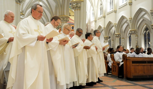 Priests of the Diocese renew their vows at the Chrism Mass at St. Joseph Cathedral
(Patrick McPartland/Staff Photographer)