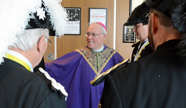 Bishop Richard J. Malone chats with members of the Knights of St. John before Mass at the 13th Annual Catholic Men's Conference presented by the Catholic Men's Fellowship of WNY The conference was held at Cardinal O'Hara High School.
(Patrick McPartland/Staff Photographer)