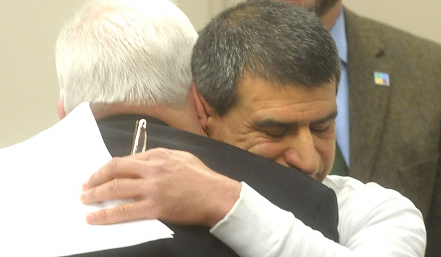 Majid Hussain receives a hug from Bishop Richard J. Malone after Hussain talked about his experience with Catholic Charities Central Intake. Hussain immigrated to Buffalo from Iraq and was in danger of losing his apartment. Catholic Charities helped him stay in his home. On March 24 the Appeal had raised $7.4 million of its $10.9 million 2015 goal..
(Patrick McPartland/Staff Photographer)