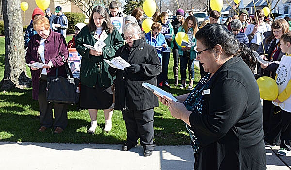 Patrick McPartland - Director of Pro-Life Activities, Cheryl Calire, gives some instruction to the marchers outside the Rosary Novena for Life Mass at St. Rose of Lima Parish. 