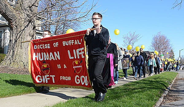 Patrick McPartland - Respect Life Marchers walk silently up Parker Avenue in Buffalo from St. Rose of Lima Parish to an abortion clinic on Main Street.