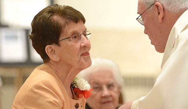 Bishop Richard J. Malone congratulates jubilarian Sister Frances Boudreau, SSJ, for her 60 years of religious service. Women and men religious cam together to celebrate their jubilee and the Year of Consecrated Life at St. Joseph Cathedral.
(Patrick McPartland/Staff Photographer)