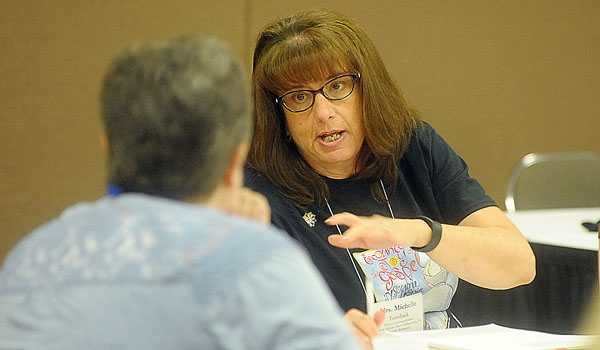 Michelle Tomshack from the Diocese of Richmond chats with another attendee at the National Conference of Catechetical Leadership's (NCCL) national gathering in downtown Buffalo.
(Patrick McPartland/Staff Photographer)