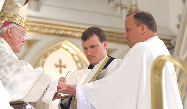 Bishop Richard J. Malone anoints the hands of Lukasz Kopala during the rite of ordination to the priesthood. The ceremony took place at St. Joseph Cathedral.
(Patrick McPartland/Staff Photographer)
