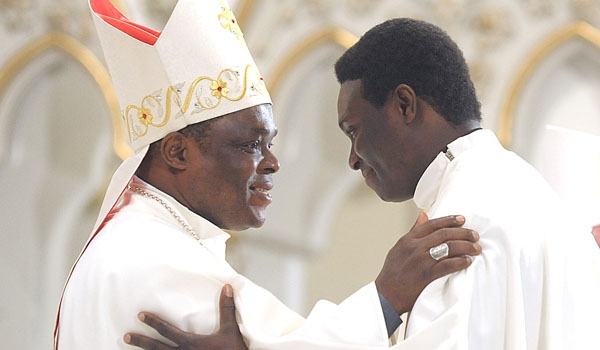 Bishop of Uromi, Nigeria, Bishop Donates Ogun welcomes Daniel Ogbeifun to the priesthood during the rite of ordination to the priesthood. The ceremony took place at St. Joseph Cathedral.
(Patrick McPartland/Staff Photographer)