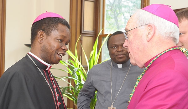 Bishop Fortunatus Nwachukwu, Papal Nuncio of Nicaragua, is greeted by Bishop Richard J. Malone just before ordination to the priesthood. The ceremony took place at St. Joseph Cathedral.
(Patrick McPartland/Staff Photographer)