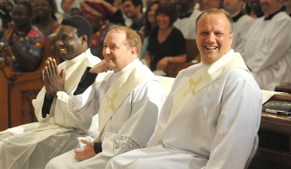 This past year saw Bishop Malone's largest ordination class in Buffalo, as Daniel Ogbeifun (from left), Thomas Mahoney and Lukasz Kopola entered the priesthood at the cathedral on June 6, 2015.