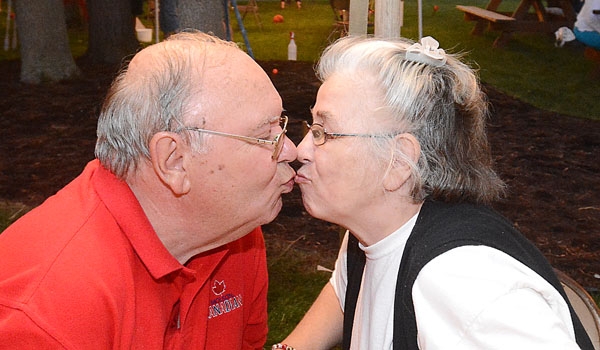 Andrew and Janet Tsakos share a kiss and 48 years of marriage at the St. John Paul II Lawn Fete.
