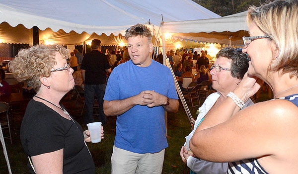 Linda Hooper (left to right), Father Peter Karalus, pastor, Rachael Hooper and Deb Corcoran chat at the St. John Paul II Lawn Fete.