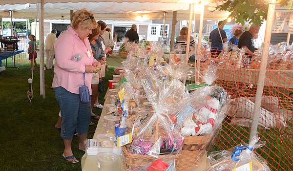 Baskets are raffled off to raise money at the St. John Paul II Lawn Fete.