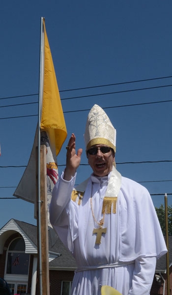 Jim Nowicki portrays St. John Paul II on the St. Stanislaus Church float as it makes its way down Harlem Road as part of the Pulaski Day Parade in Cheektowaga.