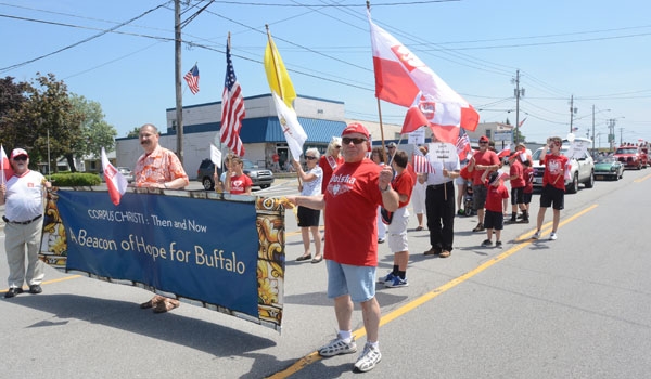 Corpus Christi Church members march down Harlem Road as part of the Pulaski Day Parade in Cheektowaga.