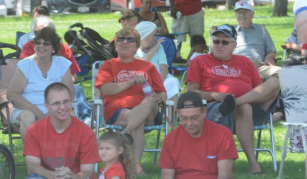 Crowds find shade to watch the Pulaski Day Parade down Harlem Road in Cheektowaga.