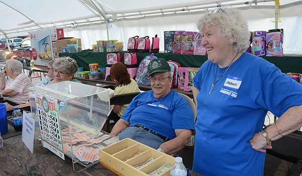 Jim and Barbara Enright sell a summeriest favorite, Pull Tabs, at the Our Lady of Charity Summerfest.
(Patrick McPartland/Staff Photographer)