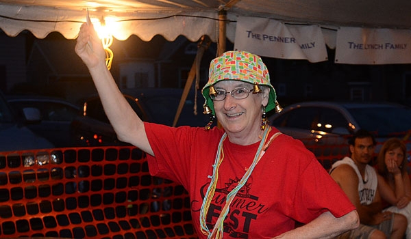 Parish Secretary, Eileen Charleton works the room to sell Pull Tabs at the Our Lady of Charity Summerfest.
(Patrick McPartland/Staff Photographer)