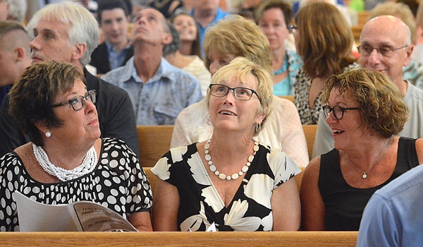 Linda Galati, Edie Boscarino and Denise Klizek look up and discuss the newly restored paintings at St. Joseph Church site.
(Patrick McPartland/Staff Photographer)