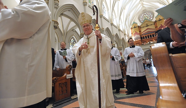 Bishop Richard J. Malone is all smiles as he enters St. Joseph Cathedral to ordain four men to the order of diaconate.
(Patrick McPartland/Staff Photographer)