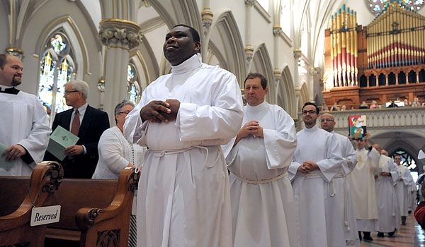  Transitional Deacons Venatius Agbasiere, Michael Brown, Samuel Giangreco and Michael LaMarca enter St. Joseph Cathedral to be ordained to the diaconate.
(Patrick McPartland/Staff Photographer)