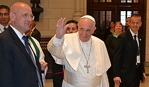 Pope Francis waves as he enters St. Patrick's Cathedral for the first time ever.