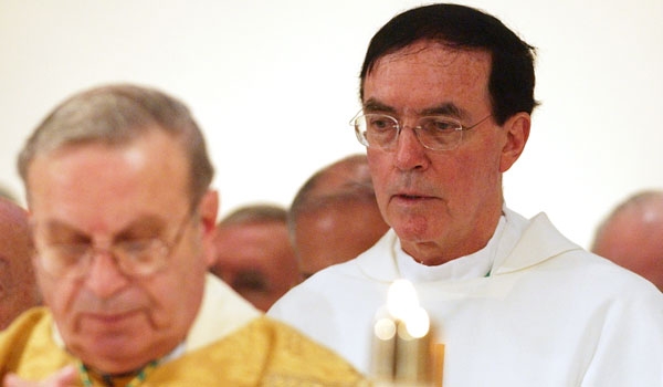 Archbishop Henry J. Mansell joins in the communion prayer during Bishop Edward Kmiec's installation Mass at St. Joseph's Cathedral. Archbishop Mansell is the predecessor to Bishop Kmiec. Archbishop Mansell was installed to the Diocese of Hartford earlier in the year.