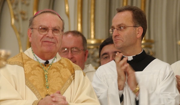 Bishop Edward Kmiec smiles as he is introduced by Edward Cardinal Eagan, archbishop of New York and metropolitan of the province of New York. Msgr. David LiPuma (right) would serve as Bishop Kmiec's secretary and master of ceremonies.