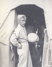 A young Dick Jeffers shows off a cake from home while serving in Europe during World War II. (Courtesy of Dick Jeffers)
