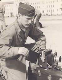 A young Dick Jeffers with one of the cameras he used as he worked as a photographer for the 9th Air Force Service Group during World War II. (Courtesy of Dick Jeffers)