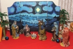 A traditional scene with a background depicting Bethlehem and the star that led the shepherds and wise men to the manger. Fr. Roy Herberger displays his collection of nativity sets at SS. Columba and Brigid Church every Christmas.