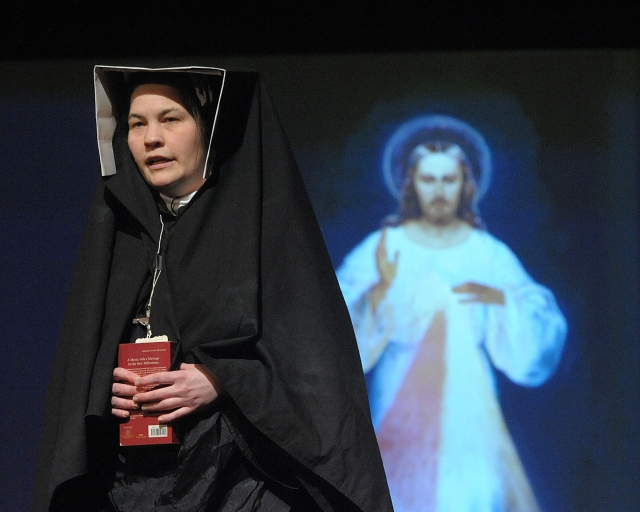 Samantha Michel portrays St. Faustina before the Prayer for Mercy at the 64th Annual Diocesan Youth Convention. Selections of St. Faustina's diary were read throughout the convention.