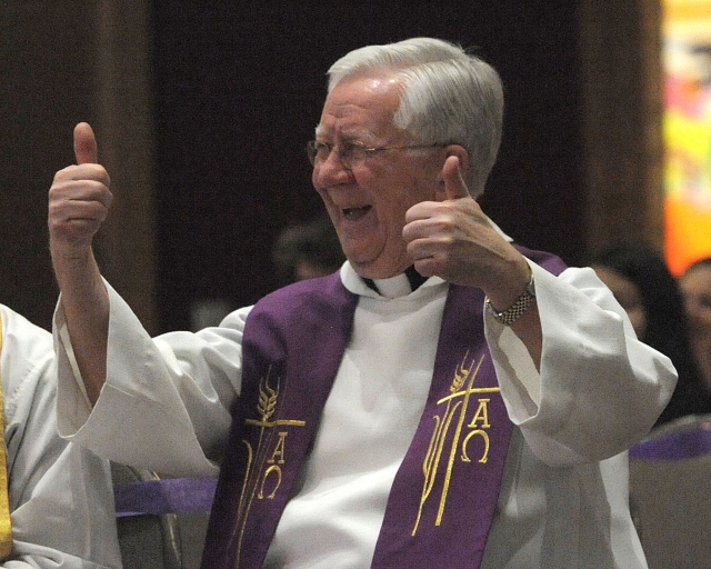 Msgr. Francis Weldgen gives a thumbs up to Bishop Richard J. Malone after the bishop said he was joining the 70-yearts-old club along with Msgr. Weldgen.
