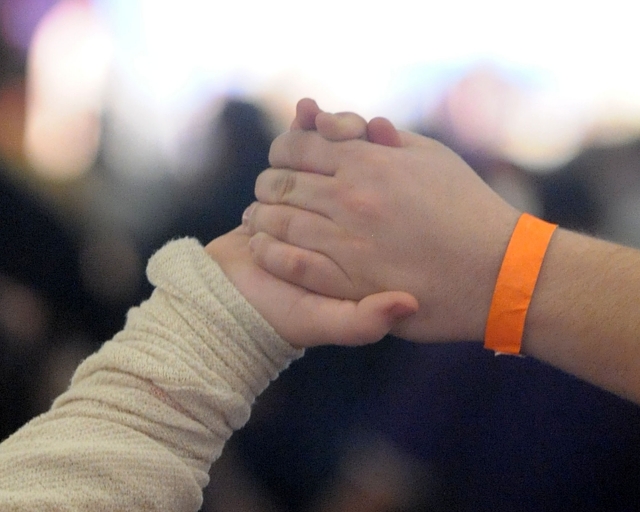 Hands clasped during the prayer of 