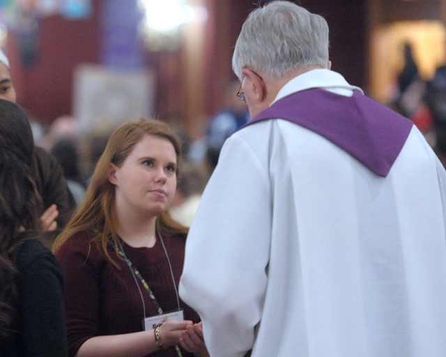 Conventioneers receive the Eucharist during the closing Mass at the 64th Annual Diocesan Youth Convention.