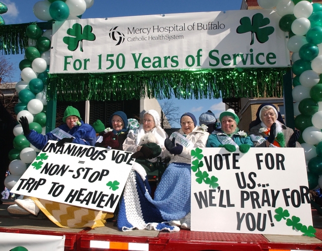 A group of Mercy Sisters try to influence the parade judges' votes as the Mercy Hospital Float makes it's way in the 2008 St. Patrick's Day Parade.