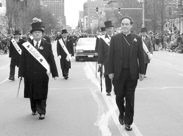 Bishop Henry J. Mansell walks in his first St. Patrick's Day Parade in 1996.