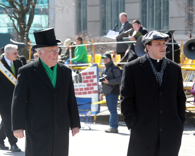 Bishop Richard J. Malone walks the 2016 St. Patrick's Day Parade up Delaware Avenue with his secretary Father Ryszard Biernat.