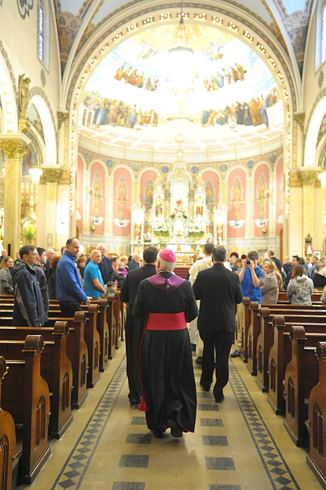 Bishop Richard J. Malone enters Corpus Christi Church, Buffalo for the blessing of baskets.