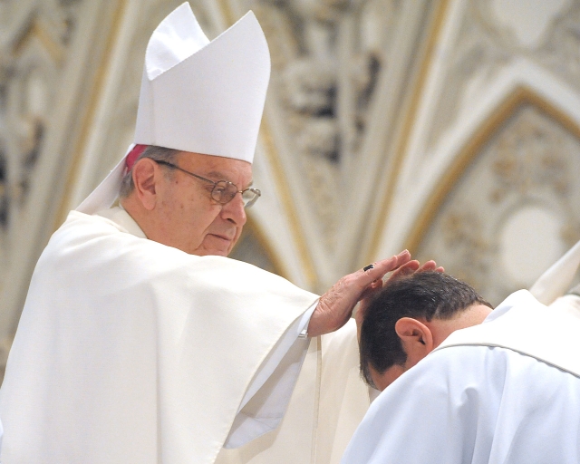 Bishop Emeritus Edward Kmiec offers his blessing during the Sacrament of Ordination at St. Joseph Cathedral on May 28, 2016.
