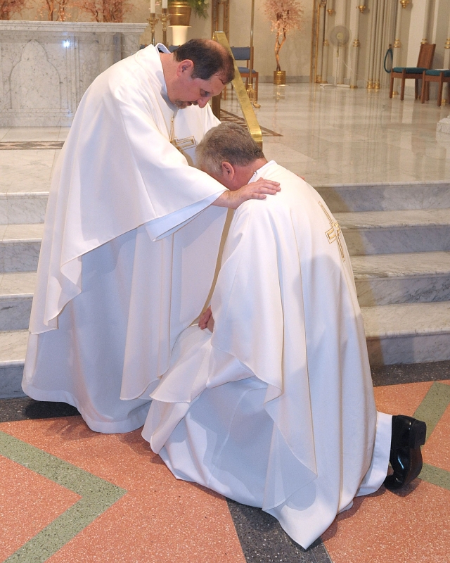 Father Michael Brown gives one of his first blessings as a priest after ordination ceremonies at St. Joseph Cathedral on May 28, 2016.
