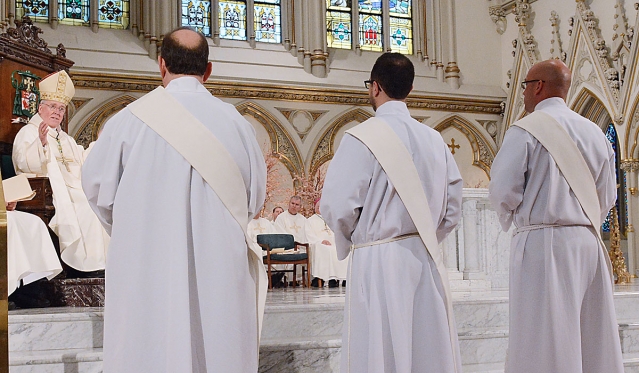 Bishop Richard J. Malone accepts the three new candidates for ordination at St. Joseph Cathedral on May 28, 2016.
