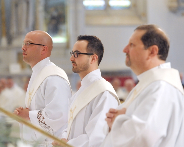 Candidates for ordination Rev. Mr. Michael LaMarca, Rev. Mr. Samuel Giangreco and Rev. Mr. Michael Brown stand before the bishop as they begin the Sacrament of Ordination at St. Joseph Cathedral on May 28, 2016.
