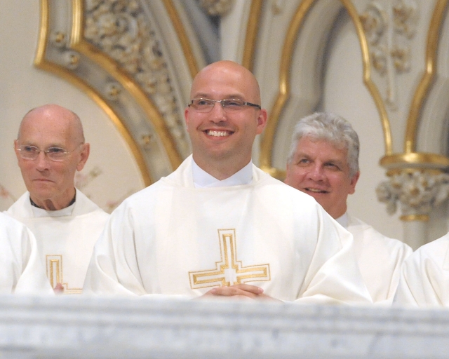 Father Michael LaMarca is all smiles after it is announced that his first placement as a priest will be at Saint John Paul II Parish, Lakeview.