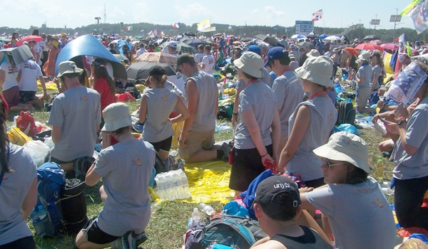 Buffalo pilgrims kneel in prayer Krakow's Campus Misericordiae, or the Field of Mercy, during the closing Mass of World Youth Day 2016 with Pope Francis on July 31. (Patrick J. Buechi/Staff)