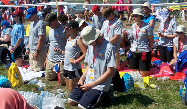 Buffalo pilgrims kneel in prayer Krakow's Campus Misericordiae, or the Field of Mercy, during the closing Mass of World Youth Day 2016 with Pope Francis on July 31. (Patrick J. Buechi/Staff)