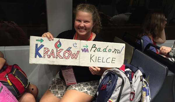 Buffalo WYD pilgrim Laura Szczepankiewicz displays a sign given to her from some new friends from Ecuador. (Patrick J. Buechi/Staff)