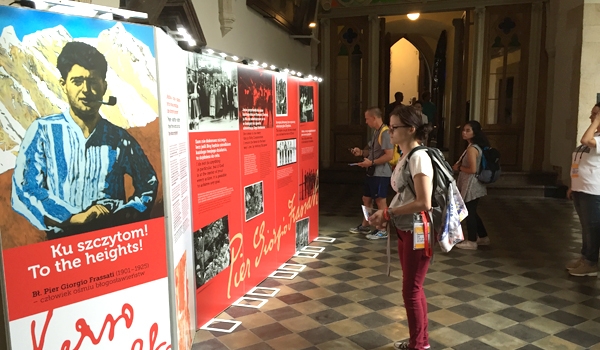Christina Mitchell checks out an exhibit on blessed Pier Giorgio Frassati during an excursion at World Youth Day 2016. (Patrick J. Buechi/Staff)