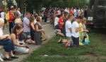 Pilgrims kneel in prayer during the opening Mass of World Youth Day 2016. The Mass, celebrated by Cardinal Stanislaw Dziwisz and dozens of other clergy, took place in Krakow